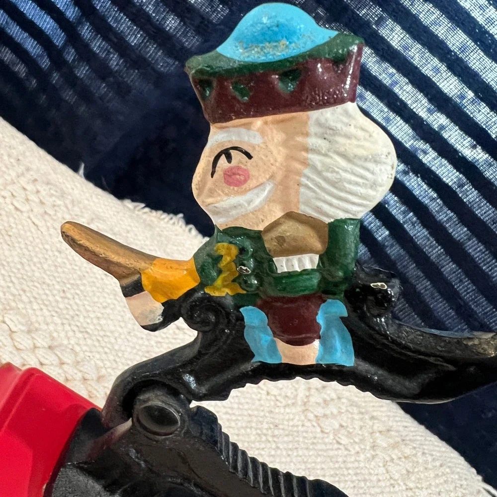 Vintage Cast Iron Nutcracker on‎ Red Wood Base Hand Painted Decor